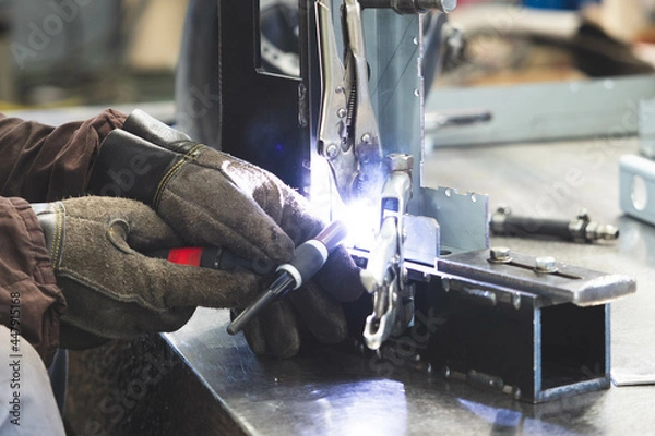 Obraz welder working in a factory