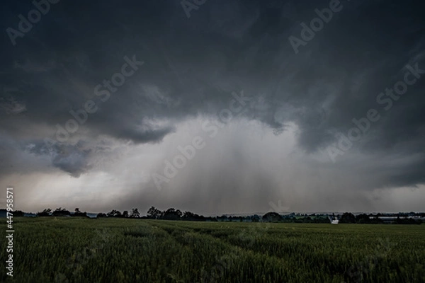 Obraz Storm over Field during climate change wirh rainfall