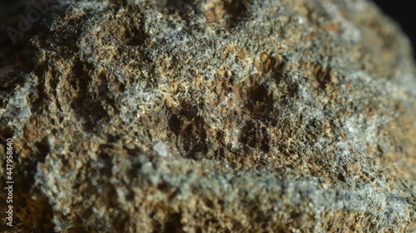 Fototapeta VOLCANIC ROCK WITH MINERALS, MACRO IMAGE WITH BLACK BACKGROUND