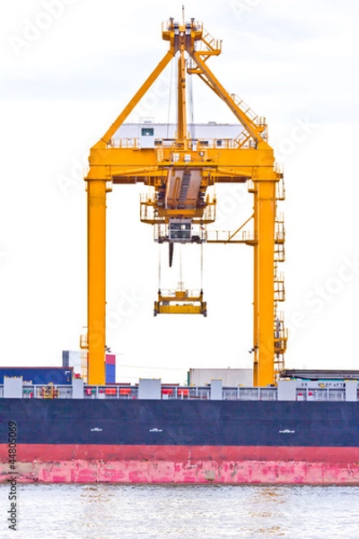 Obraz crane working with container cargo in shipyard
