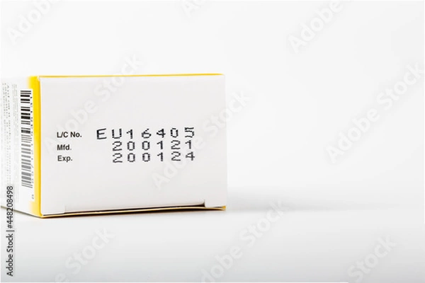 Obraz Instruction of lot number, manufacturing date, and expiry date label of a product on the bottom lid of the package with isolated white background and copy space.