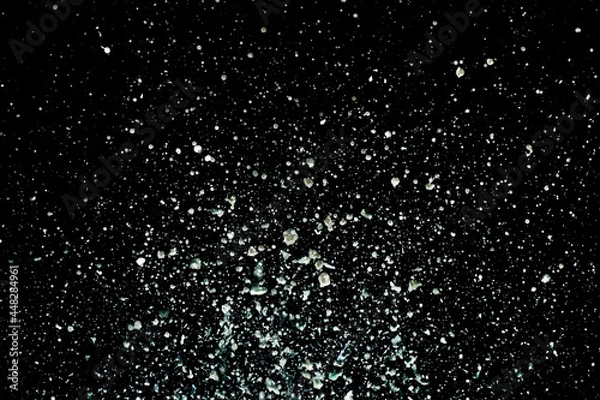 Obraz Explosion of water drops on black background. Studio shot