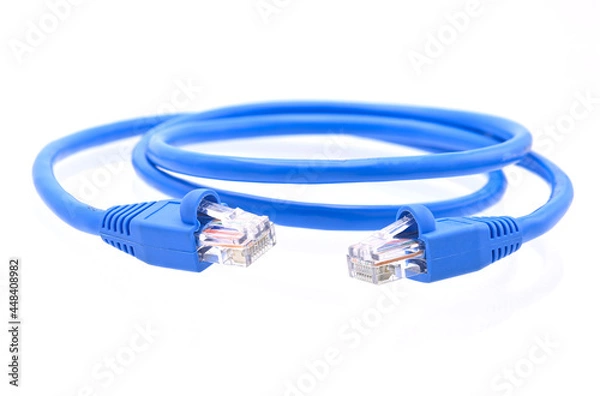 Fototapeta blue LAN cable that is coiled in a circle on white background closeup