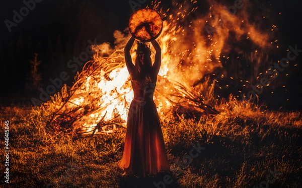 Obraz beautiful shamanic girl playing on shaman frame drum in the nature.