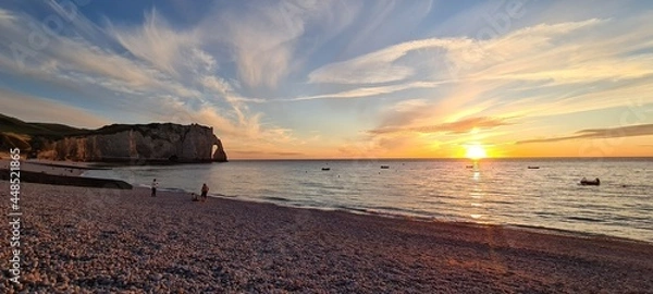 Fototapeta Etretat cliffs in the sunset colours on a hot summer day