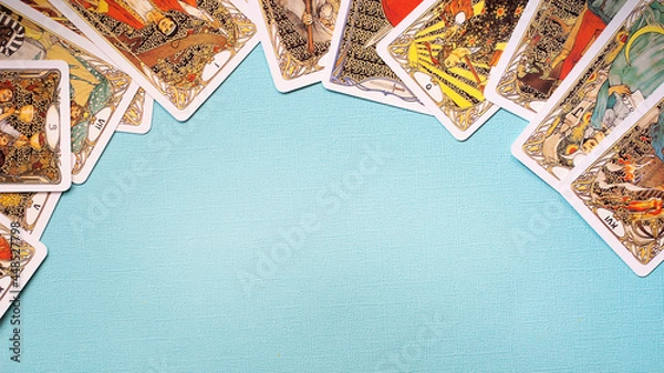 Fototapeta View of Golden tarot cards Frame on the Blue background, esoteric concept,