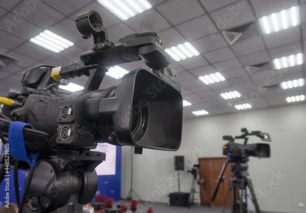 Fototapeta TV camera in the press conference room.