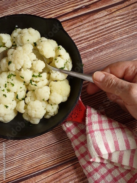 Obraz Cooked cauliflower ready to eat served in a cast iron skillet