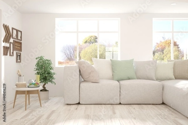 Fototapeta Stylish room in white color with sofa and autumn landscape in window. Scandinavian interior design. 3D illustration