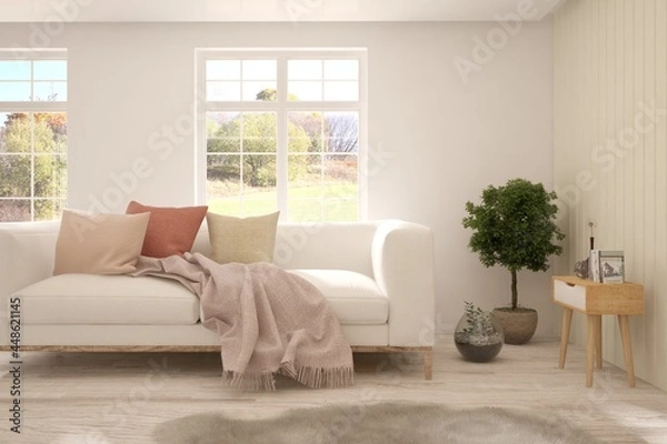 Fototapeta Stylish room in white color with sofa and autumn landscape in window. Scandinavian interior design. 3D illustration