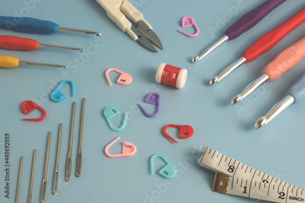 Fototapeta knitting kit on a blue background