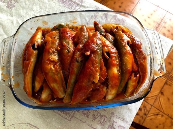 Obraz Donzella fish cooked with tomato sauce