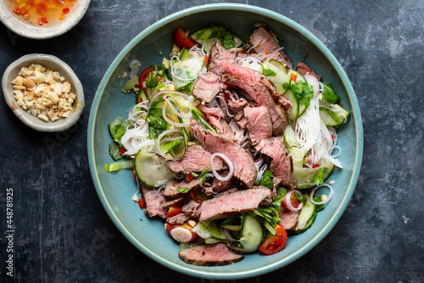 Obraz Thai style beef salad with cucumber and peanuts