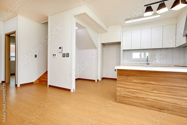 Fototapeta 깔끔하고 심플한 현대식  오픈형 주방의 테이블과 식탁