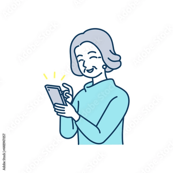 Fototapeta 笑顔でスマートフォンを使っている高齢女性