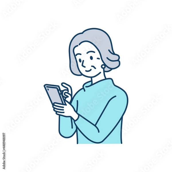 Fototapeta スマートフォンを使っている高齢女性