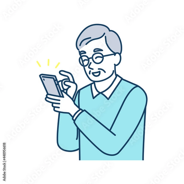 Fototapeta 笑顔でスマートフォンを使っている高齢男性