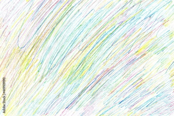 Fototapeta The texture of hand-drawn hatching with colored pencils in blue, yellow, green and red. A shaded sheet of paper, a multicolored handwritten background.