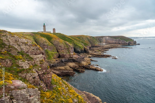 Fototapeta The beautiful coastline next to the Phare Du Cap Frehel is a maritime lighthouse in Cotes-d´Armor (France). At the tip of Cap Frehel
