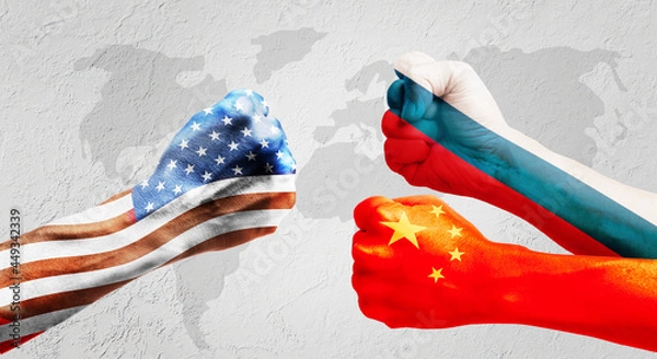 Fototapeta Flags of usa or United States of America , Russia and China on hands punch to each others on light gray world map background, USA vs China and Russia in world war crisis concept