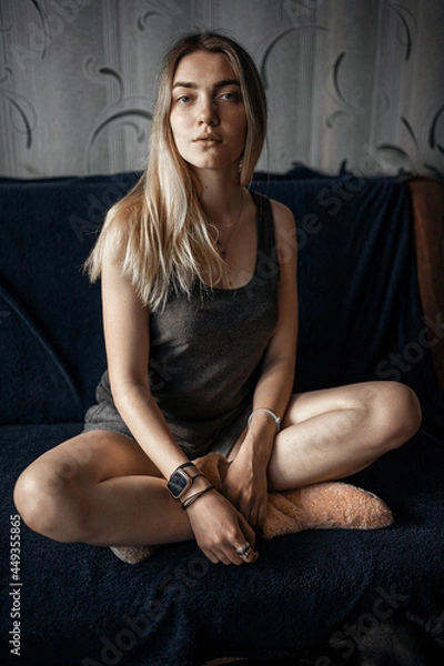 Obraz person sitting on a sofa