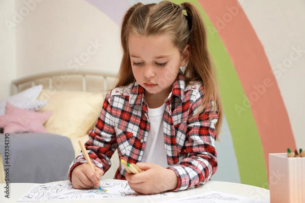 Obraz Little girl coloring antistress page at table indoors