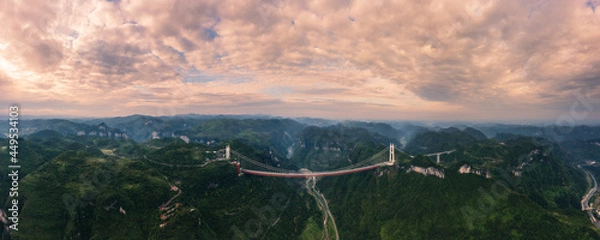 Obraz The Aizhai Bridge is a suspension bridge on the G65 Baotou–Maoming Expressway near Jishou, Hunan, China. It is also the world's highest and longest tunnel-to-tunnel bridge.