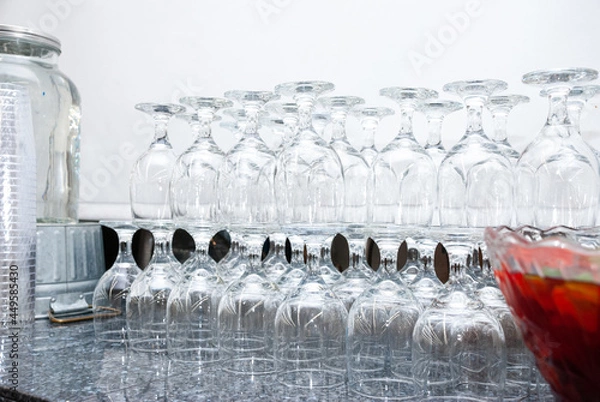 Fototapeta Clean empty glasses lined up on a table