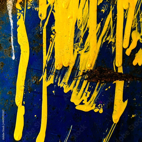 Obraz background with paint. metallic surface with yellow paint drips