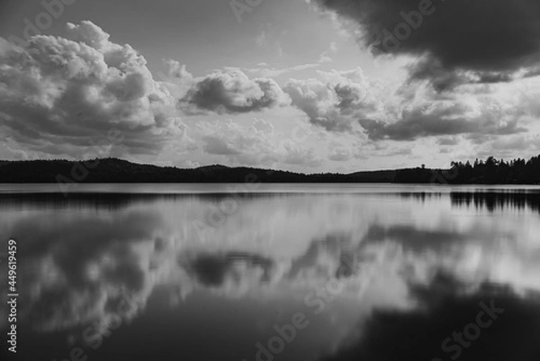 Fototapeta A large lake on a cloudy, summers day