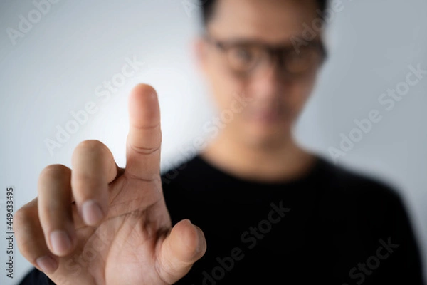 Obraz Blur businessman pushing on a touch screen interface