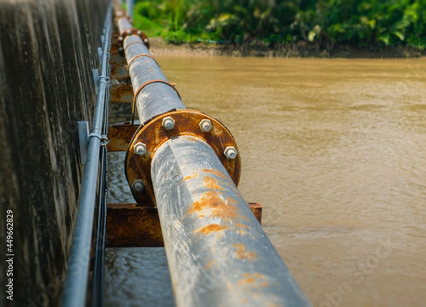 Fototapeta An old rusty water pipeline. Pipeline for water consumption in Thailand.