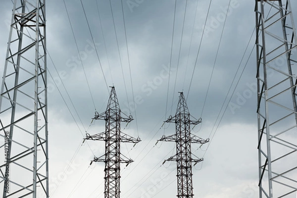Fototapeta high-voltage power line with metal poles and cables