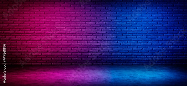 Obraz black brick wall  background with neon lighting effect pink purple and blue. glowing lights on empty brick wall background