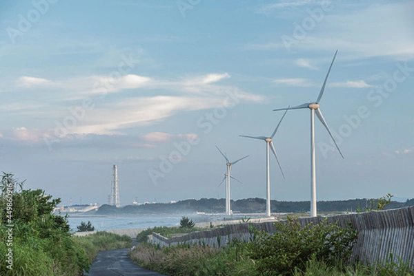 Fototapeta 風力発電の風車と火力発電所の煙突