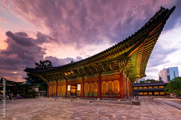 Fototapeta Side view of Junghwajeon the main hall of Deoksugung Palace at sunset. Inscriptions under the roof means Junghwajeon and name the hall. Seoul, South Korea.