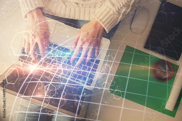 Fototapeta Double exposure of woman hands working on computer and world map hologram drawing. Top View. International business concept.