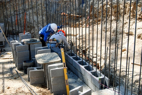 Fototapeta Starting a new structural block retaining wall build