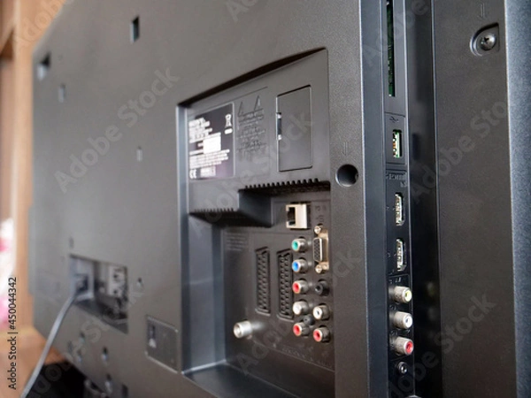 Obraz Rear side of black tv set, close up of connection ports panel.