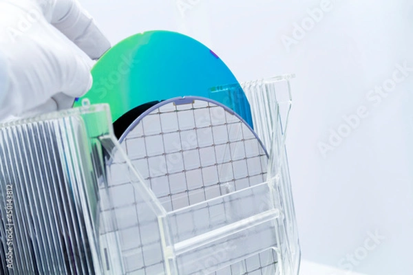 Fototapeta Silicon Wafers in storage box on table in clear room prepared for production of semiconductor foundry.