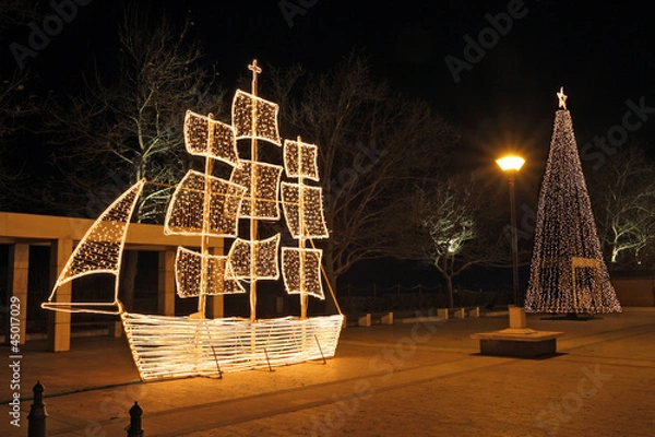 Obraz Christmas ship and tree at night, in Greece