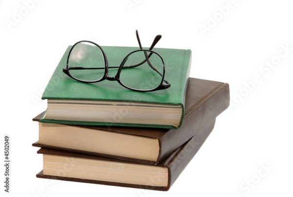 Obraz pile of books and eyeglasses
