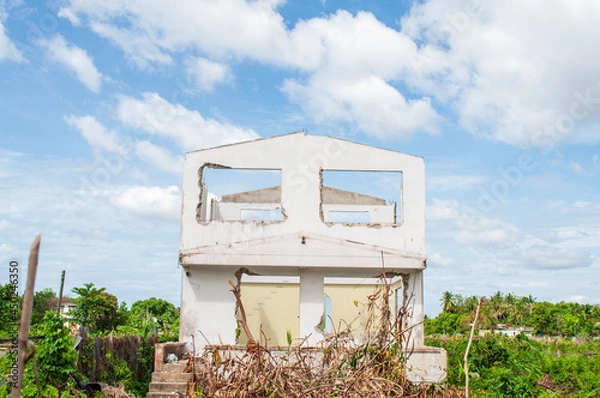 Fototapeta The windows of an abandoned house were demolished to rebuild.
