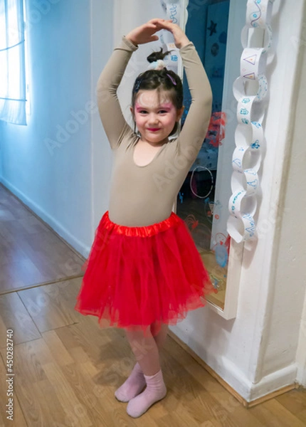 Fototapeta Little girl posing dressed up as a ballerina