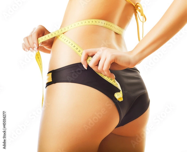 Obraz slimming woman in panties with measure