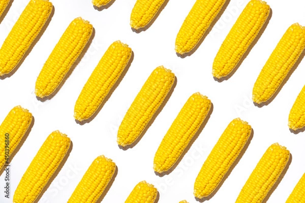 Fototapeta Corn on a white background. Selective focus. Pattern