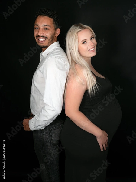 Obraz Stylish and happy multi-ethnic couple expecting a baby