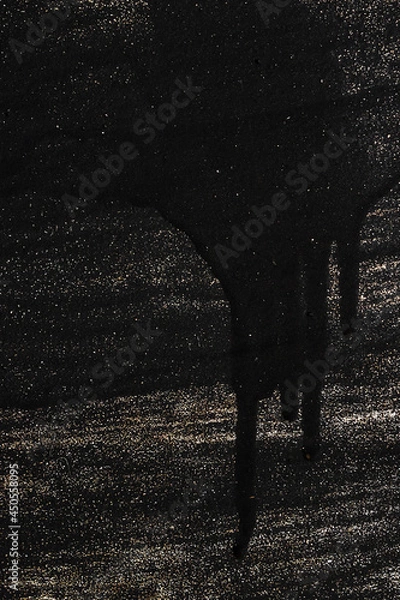 Fototapeta a trace of black paint and smudges on a painted metallic background, decorative wall