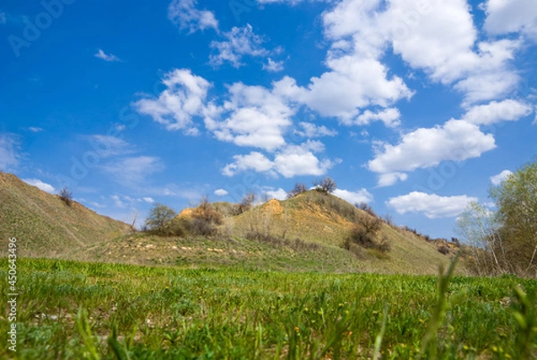 Obraz Yellow hills under blue sky with clouds