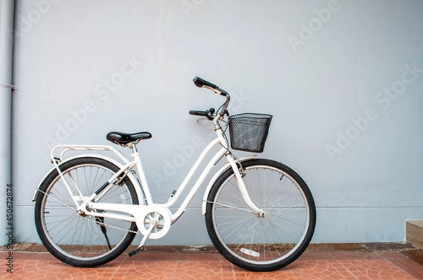 Fototapeta white bicycle on white wall background